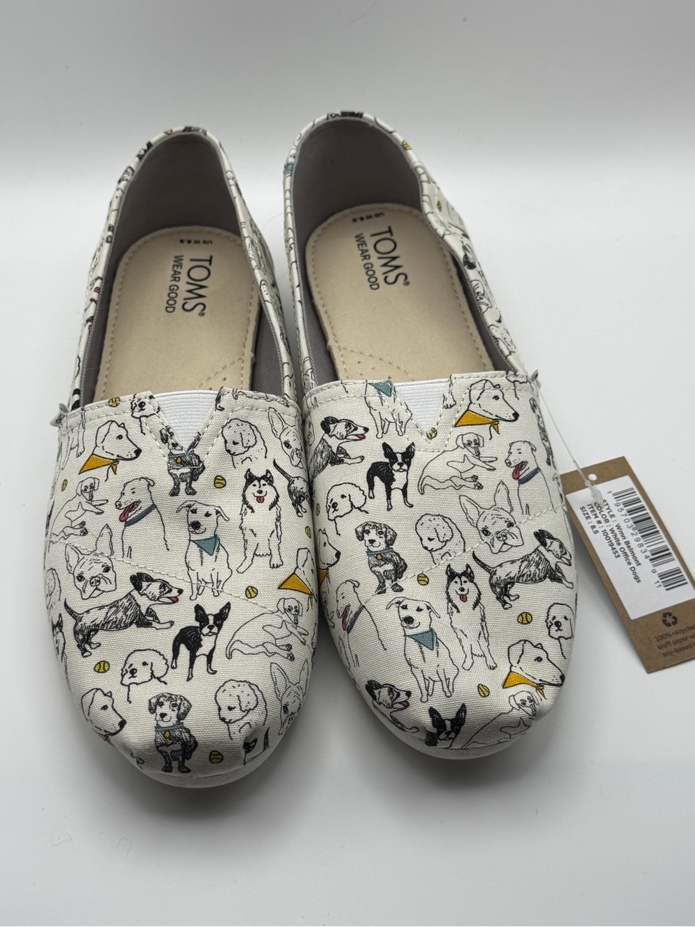 TOMS Womans 8.5 Canvas Slip-Ons with Multicolor Dog Print on Cream Canvas